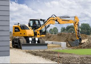 Excavatrice sur pneus Liebherr A 910 Compact Litronic