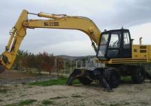 Excavatrice sur pneus FAI 1100