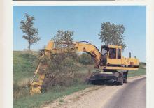 Excavatrice sur pneus Caterpillar 214B FT