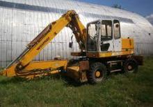 Excavatrice sur pneus Weimar M 1520