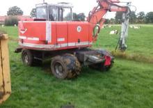 Excavatrice sur pneus O&K MH 2.10