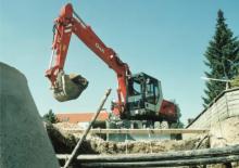 Excavatrice sur pneus O&K MH 5 Compact
