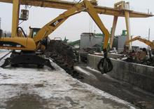 Excavatrice sur pneus Caterpillar M 318 C MH