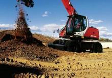 Excavatrice sur pneus O&K MH PLUS PMS